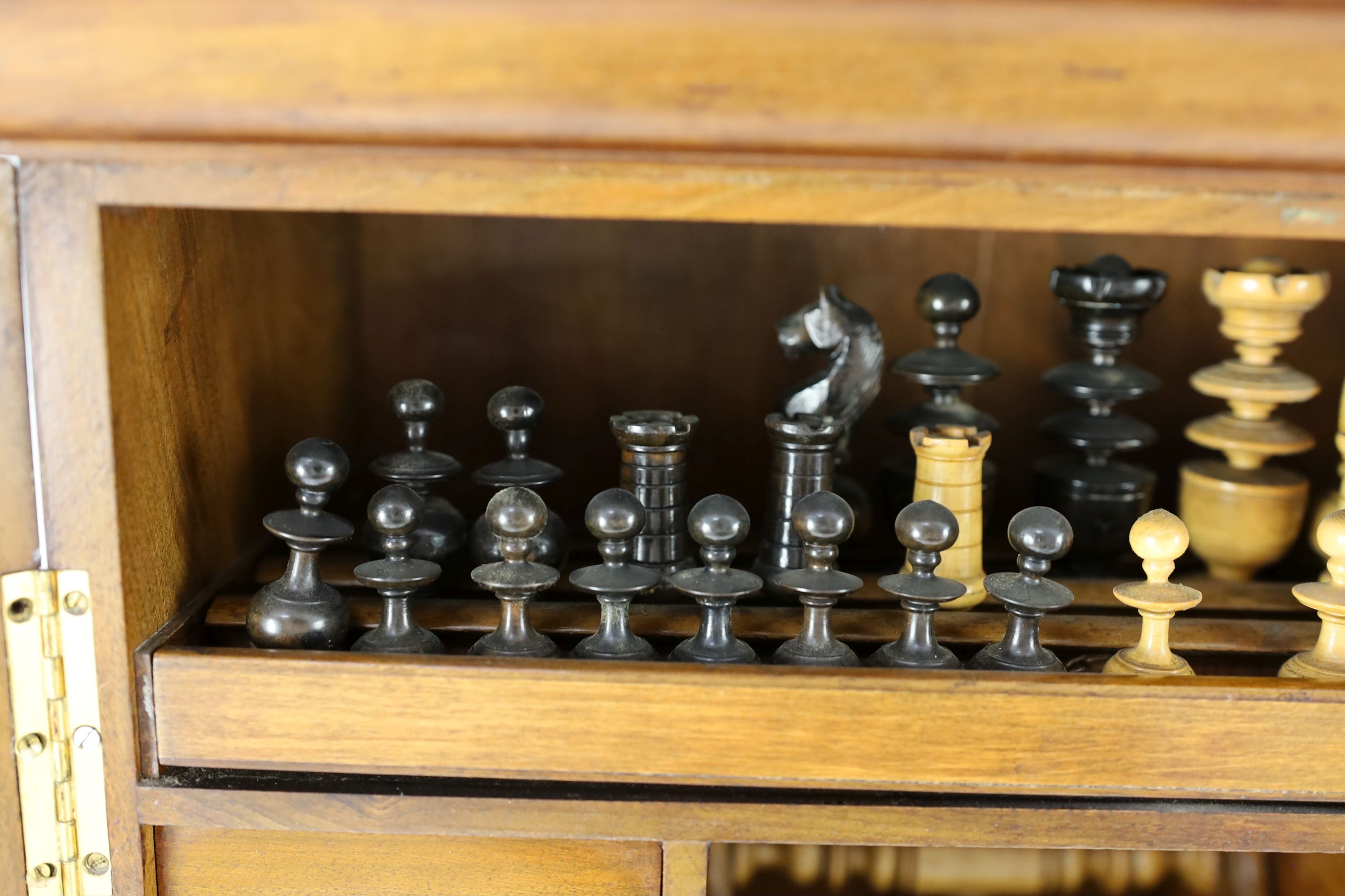 A late 19th century gilt metal mounted walnut games cabinet, W.40cm D.19cm H.49cm